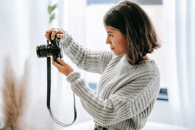 Woman taking photos with a camera