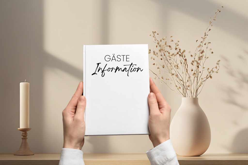 A white folder labelled ‘Guest Information’ held by two hands.